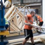 Workers making roof trusses